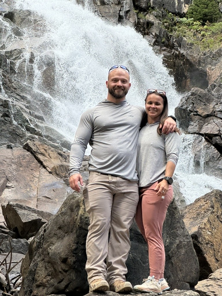 Ian and Keeli at a waterfall in the Tetons